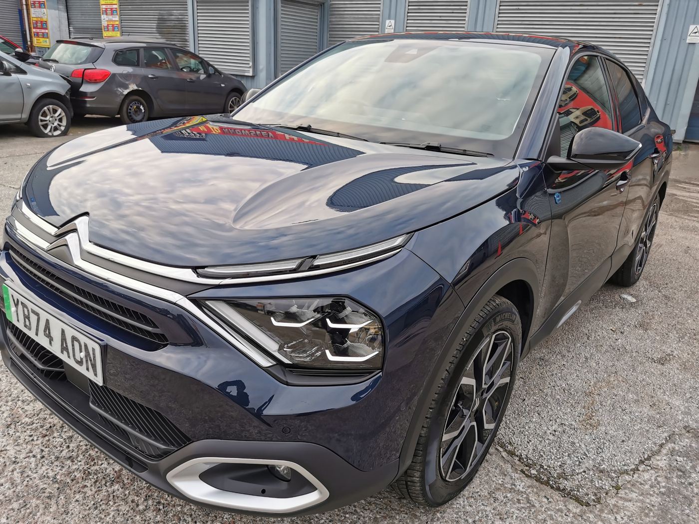 Navy Citroën ë-C4 X on the Kingman Cars forecourt
